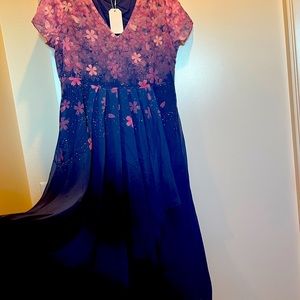 Light weight dress. Runs on the smaller side, more like medium. New.